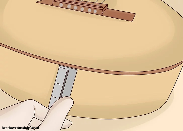 سوراخ کردن گیتار برای وصل کردن بند گیتار